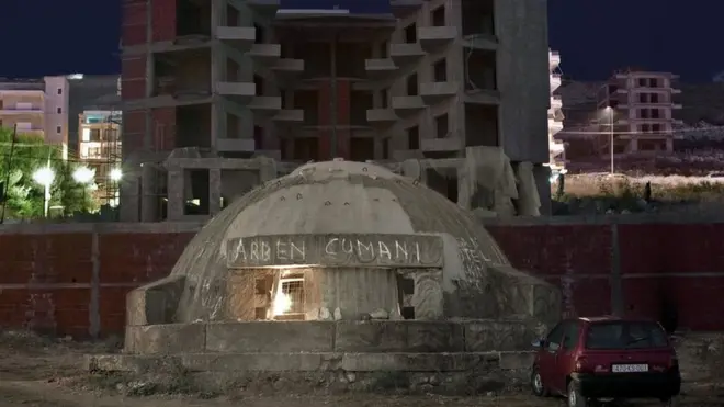 Bunker in Albania next to buildings
