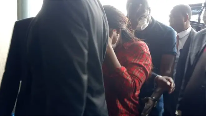 Funke Akindele and her husband as dem dey enter court