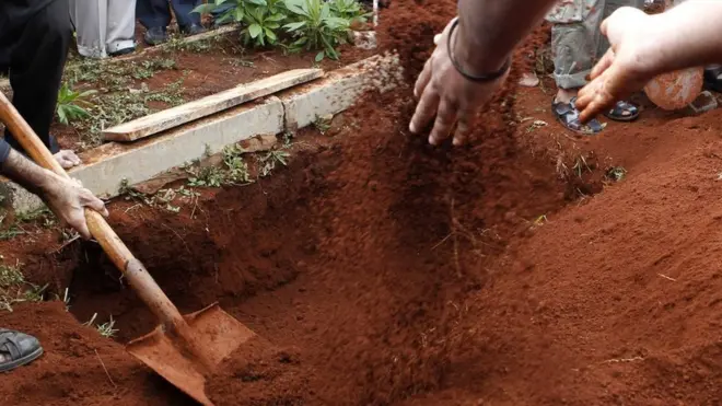 The body was dressed in a new set of clothes and re-buried