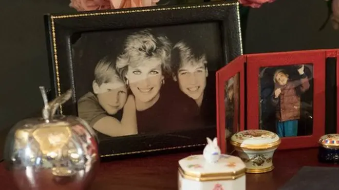Princes William and Harry chose some of the pieces on the desk to reflect her commitement to duty, and their personal memory of her