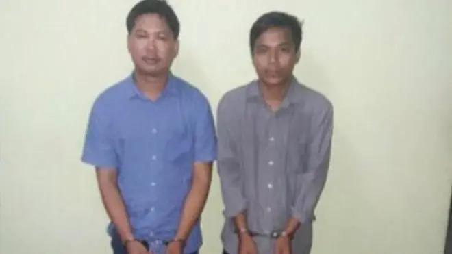 The government released this picture of the two reporters in handcuffs