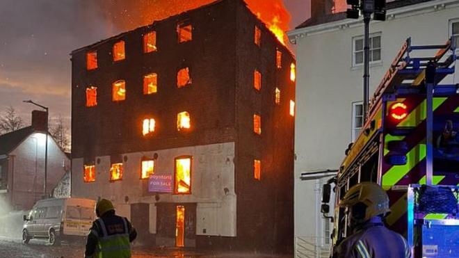 Crews damping down after Boston derelict building fire