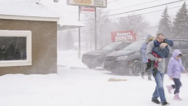 A family huddled together in Flint, Michigan