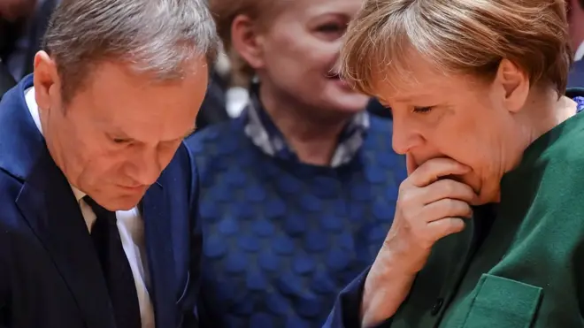German Chancellor Angela Merkel, right, speaks to European Council President Donald Tusk, left, and Lithuanian President Dalia Grybauskaite, centre, during a round-table meeting at an EU summit in Brussels on Friday, 10 March