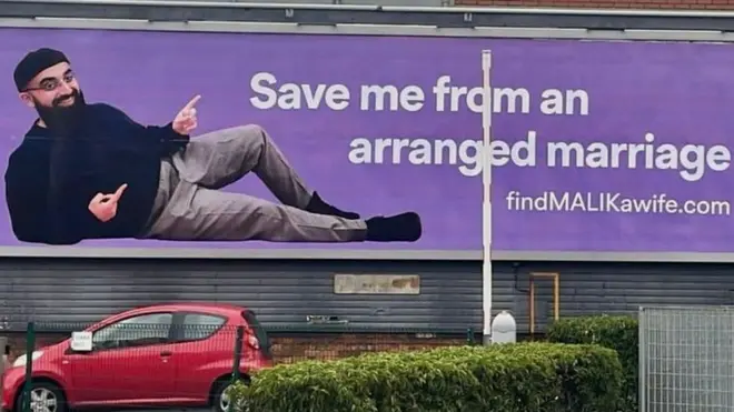 A bill board with an image of Malik Mohammed with the caption 'Save me from an arranged marriage'
