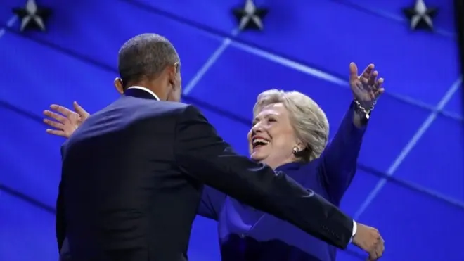 US President Barack Obama greets Democratic presidential nominee Hillary Clinton at the end of the third day of the Democratic convention.