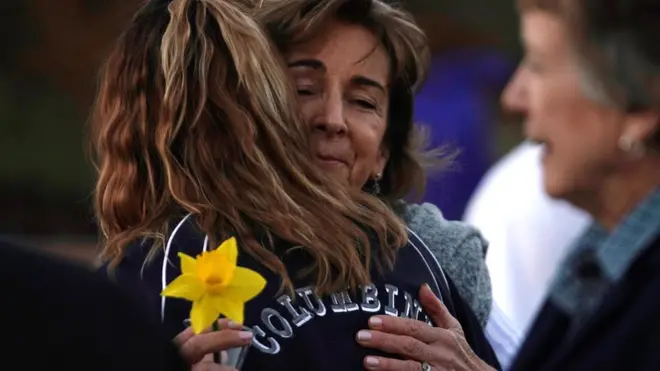 Columbine victim's mother hugs a visitor
