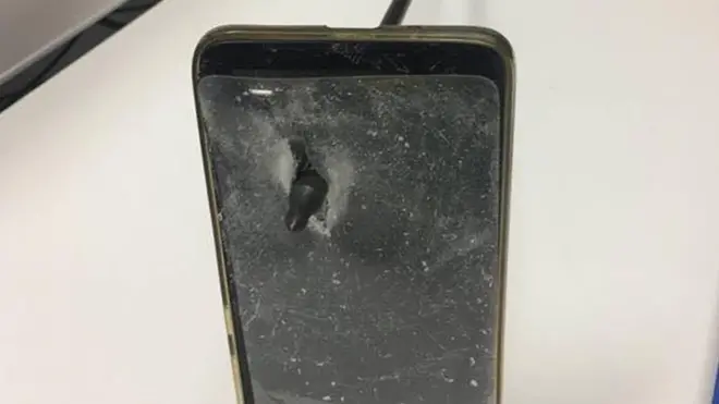 The man was shielded from the arrow by his phone