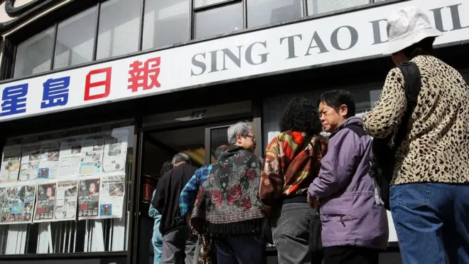 Chinese Americans line up outside of the Sing Tao News offices to donate money for the victims of the earthquake in China May 14, 2008 in the Chinatown neighborhood of San Francisco, California.
