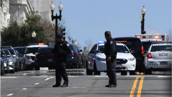 Officer investigate the crime scene