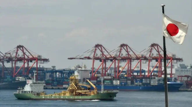 Japan flag waves along the coastline