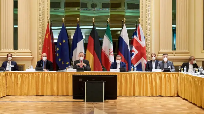 European External Action Service (EEAS) Deputy Secretary General Enrique Mora and Iranian Deputy at Ministry of Foreign Affairs Abbas Araghchi wait for the start of a meeting of the JCPOA Joint Commission in Vienna, Austria (6 April 2021)