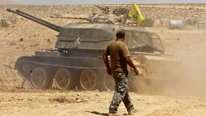 Hezbollah fighters allied to Iran fight in support of the Syrian government