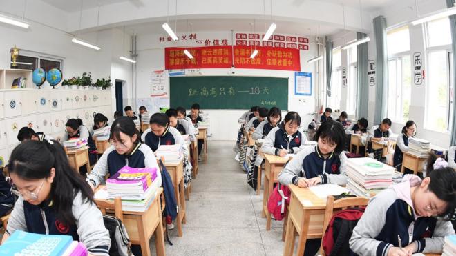 enior three students review their lessons carefully in the classroom, Guiyang City, Guizhou Province, China, May 20, 2021