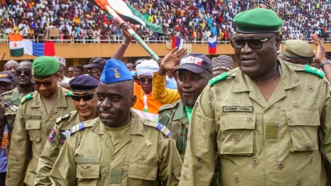 Niger's junta leaders were cheered by thousands of supporters at a defiant rally in Niamey on Sunday