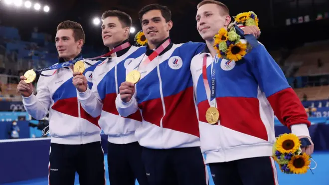 David Belyavskiy, Nikita Nagornyy, Artur Dalaloyan and Denis Abliazin of Team ROC pose with the gold medal after winning the Men's Team Gymnastics Final