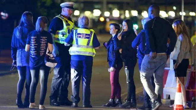 Police officers urged people to stay calm and move away from the cordons