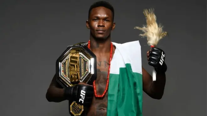 Israel Adesanya of Nigeria pose for one portrait backstage after im victory during di UFC 248 event for T-Mobile Arena on March 07