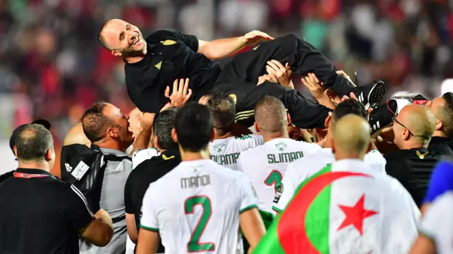 Algeria coach Djamel Belmadi is lifted in the air by his players after winning the 2019 Africa Cup of Nations title