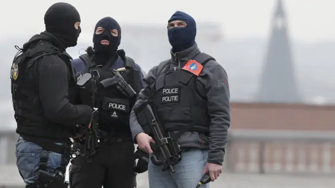 Masked Belgian police secure area around Palais de Justice courthouse in Brussels. March 24, 2016