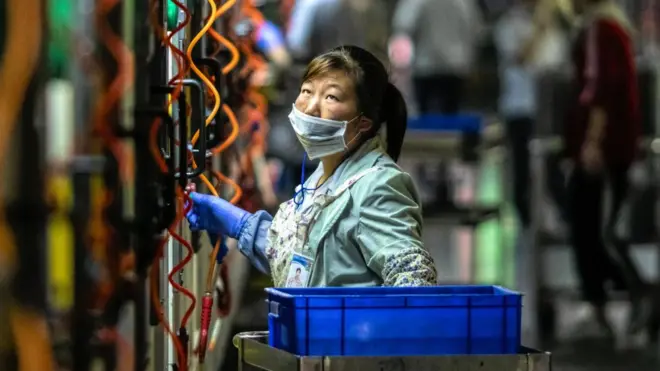 A woman works in Everwin precision technology factory in Dongguan, Guangdong Province, China, 09 May 2019.