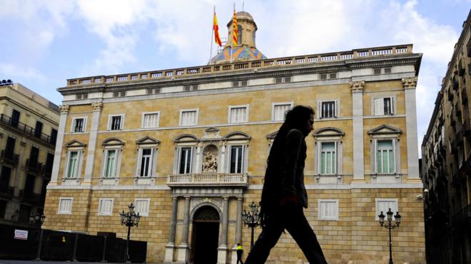 Man walks past Catalan parliament, Barcelona