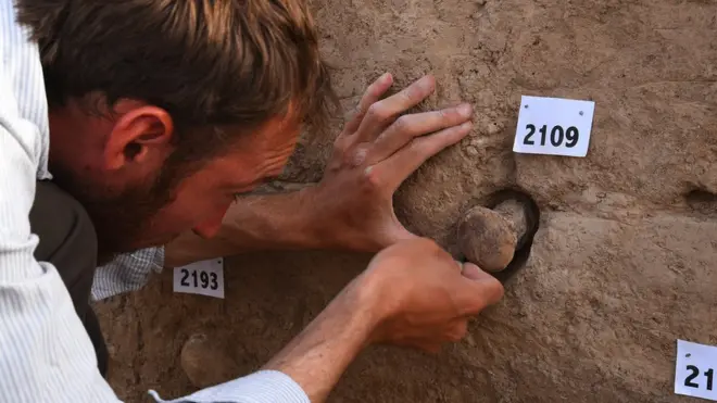 The three clay cones are identified as coming from a temple in southern Iraq