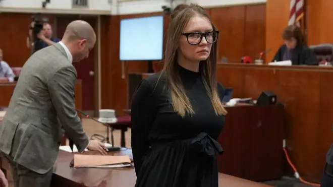 Fake German heiress Anna Sorokin is led away after being sentenced