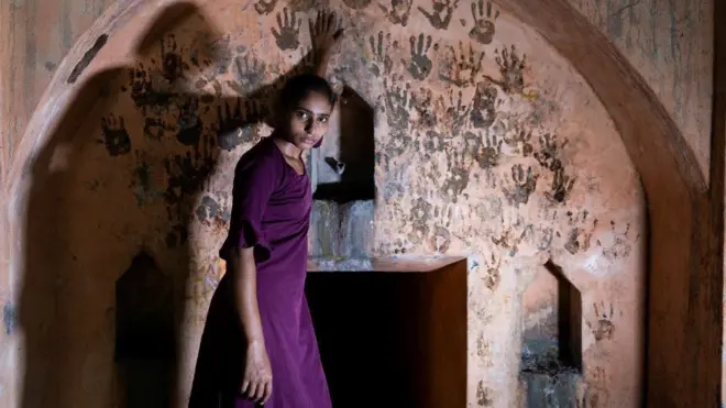 Priyanka at a local temple where newlywed couples leave their handprints on the wall