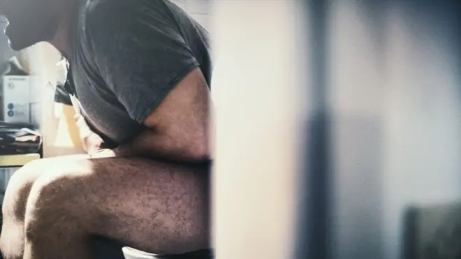 Man sitting at the toilet
