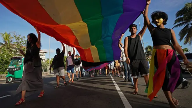 Sri Lankan LGBTQ community members and Equal rights activists participate in a Pride parade in Colombo on 25 June 2022.