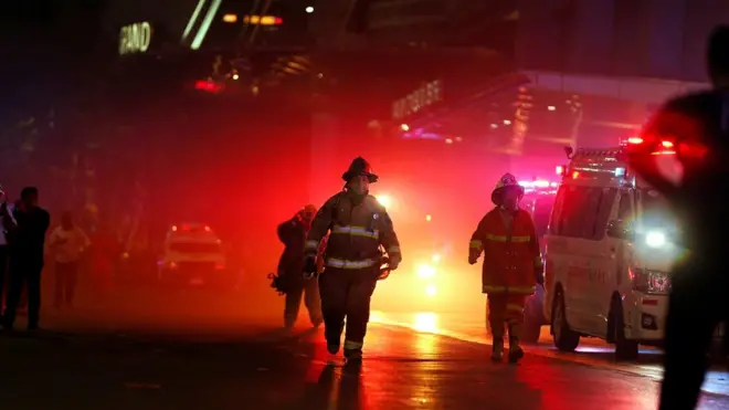 Rescue workers work after the Central World Complex was evacuated due to a fire, in Bangkok, Thailand, April 10, 2019. REUTERS