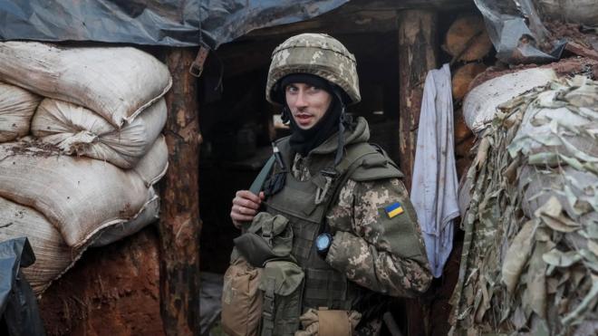 A Ukrainian service member is seen on the front line near the city of Novoluhanske in the Donetsk region