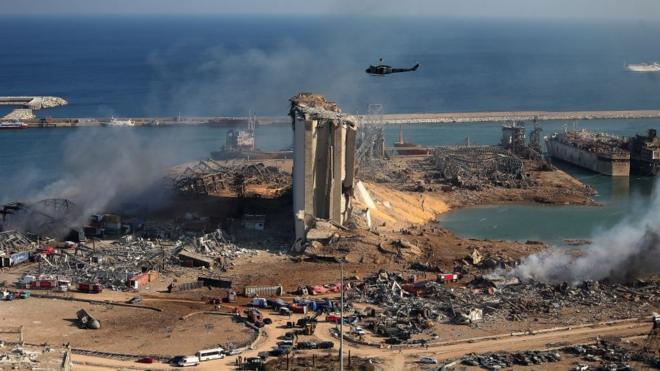 A general view shows the damaged grain silos of Beirut's harbour and its surroundings