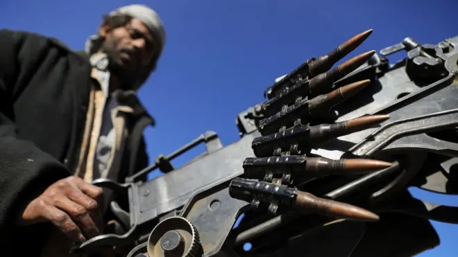 A Houthi follower mans a machine gun on a pick-up truck during a protest to decry the US-led strikes on Houthi targets and to show support to Palestinians in the Gaza Strip