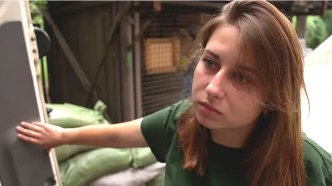 21-year-old Polina says she excercises and listens to music to keep some sense of normality