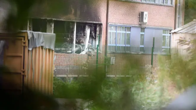 Damage can be seen at the building of the National Criminology Lab in Brussels on Monday, Aug. 29, 2016.