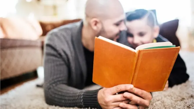 Father and son reading