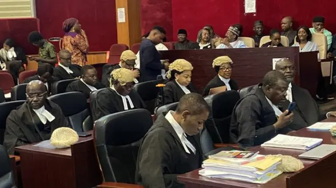 Lawyers siddon inside court