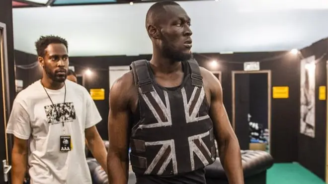 Stormzy leaving his dressing room to head to the Pyramid Stage in 2019
