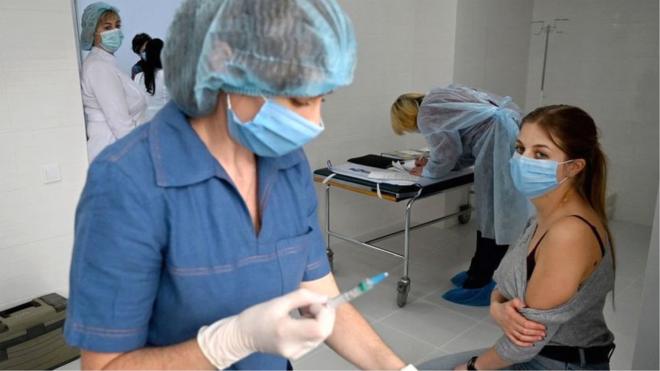 medical worker receives a dose of the Oxford/AstraZeneca vaccine against the coronavirus disease in Ukraine