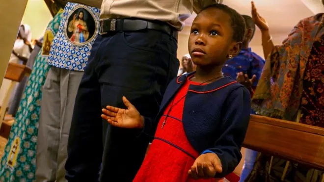Girl praying in church