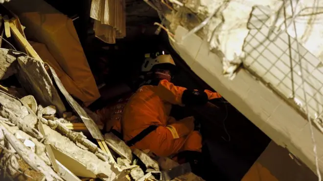 A rescuer in Tainan, Taiwan, 7 February
