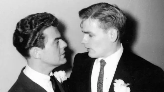 Two grooms at their wedding