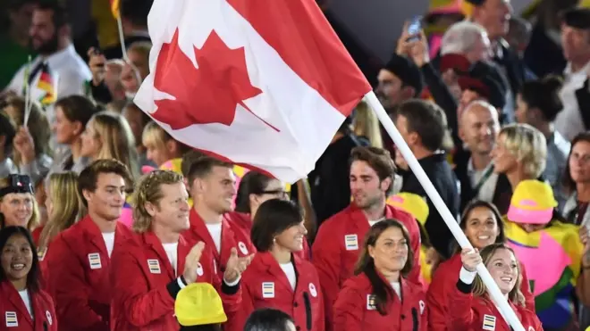 Canada's flag bearer Rosannagh Maclennan leads her national delegation during the opening ceremony of the Rio 2016 Olympic Games at the Maracana stadium in Rio de Janeiro on August 5, 2016