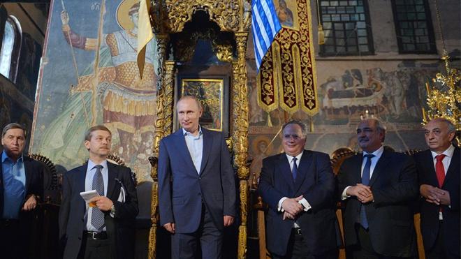 GREECE - MAY 28, 2016: Russian Presidential Aide Yuri Ushakov (L), Russia's President Vladimir Putin (C), Greece's Foreign Minister Nikos Kotzias (3rd R), and a Mount Athos Civil Governor Aristos Kasmiroglou (R) at the Protaton church (the Church of the Assumption of Our Lady) on Mount Athos. Alexei Druzhinin/Russian Presidential Press and Information Office/TASS