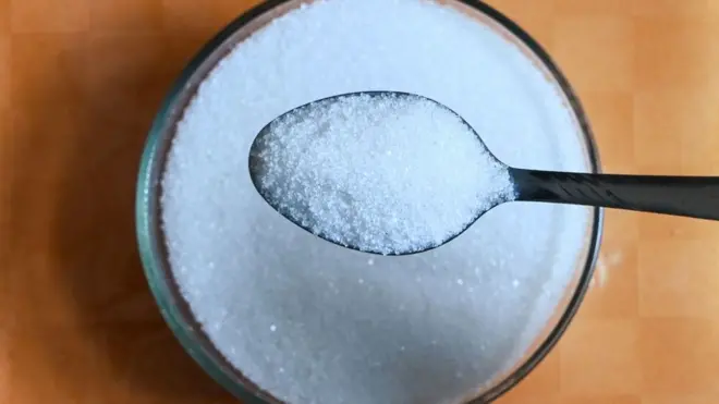 This photo illustration taken on April 22, 2020 shows a teaspoon of sugar
