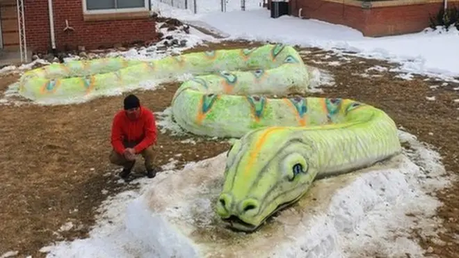 The Mosley family worked together for 10 hours to create the snake sculpture
