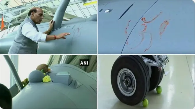రఫేల్ యుద్ధ విమానానికి పూజ చేస్తున్న కేంద్ర రక్షణ శాఖ మంత్రి రాజ్‌నాథ్ సింగ్