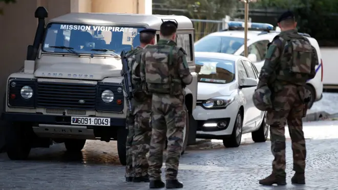 Soldiers secure the street near the scene where French soldiers were hit and injured by a vehicle in the western Paris suburb of Levallois-Perret, France, on 9 August 2017